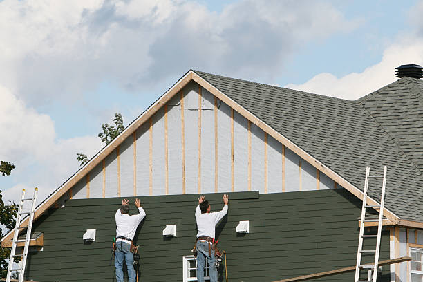 Professional Storm Damage Siding Repair technician working in Andover, MN